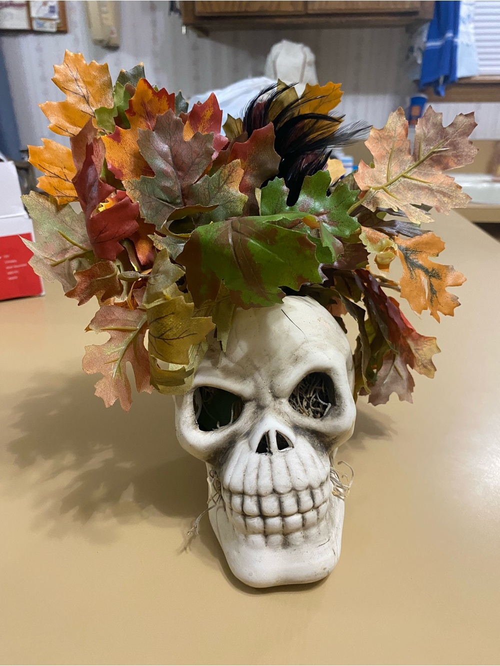 White Skull Vase with Autumn Leaf Faux Floral Arrangement